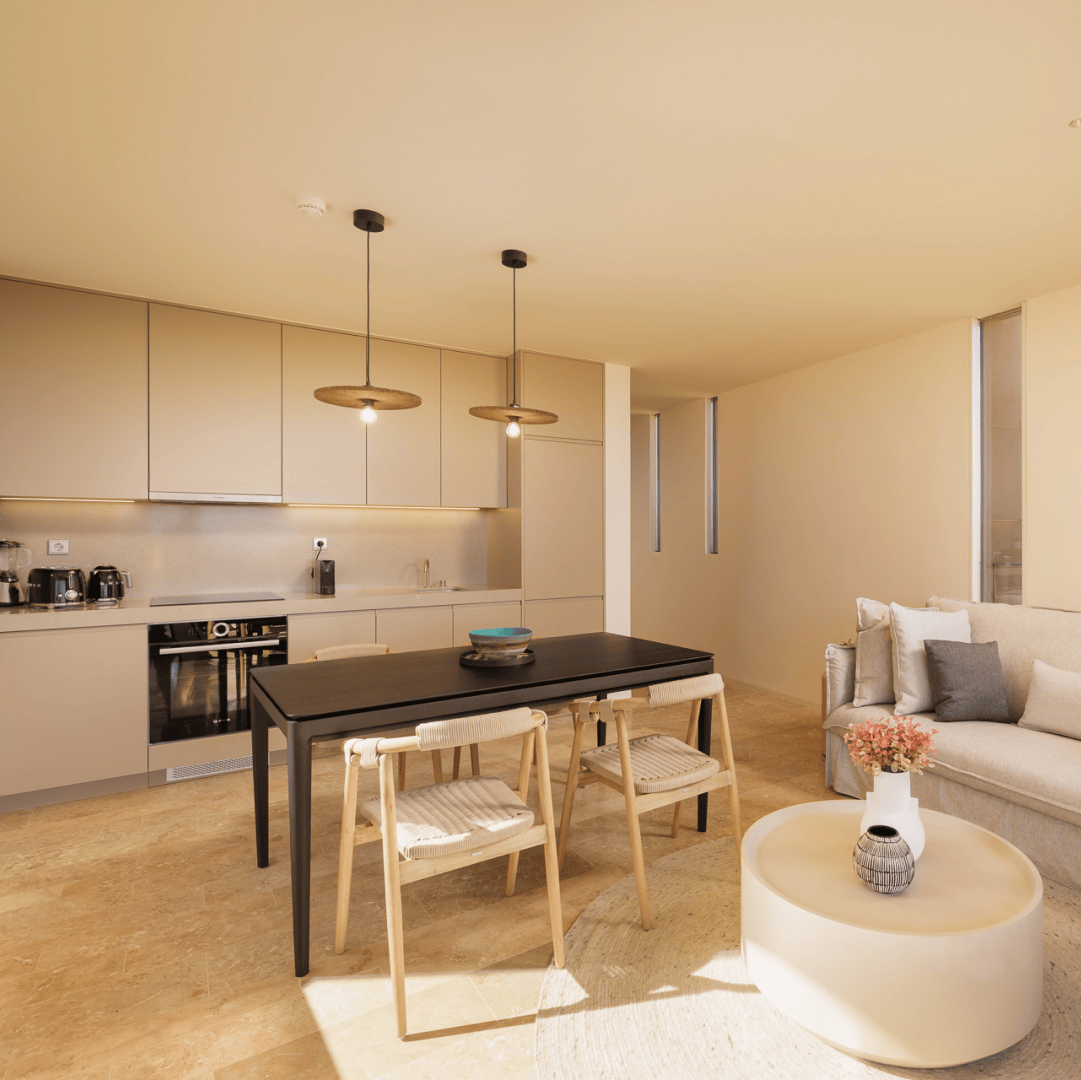 Vista da cozinha e sala integradas nos Palmares Signature Apartments, com tons neutros e mobiliário moderno que reforçam a sofisticação do espaço.