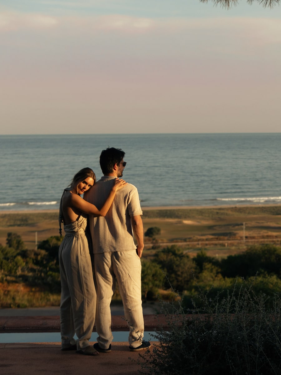 couple watching palmares beach